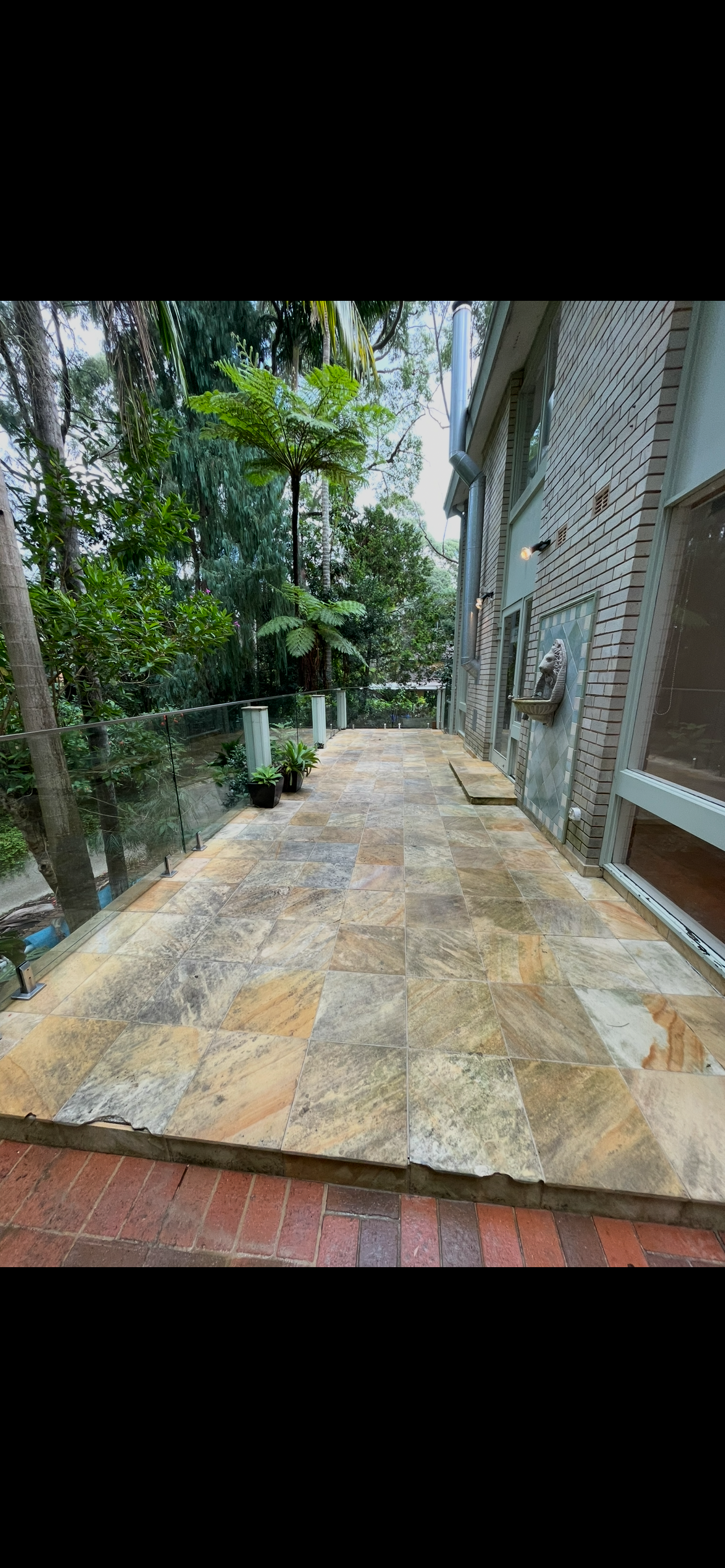 Tiled entrance after pressure washing