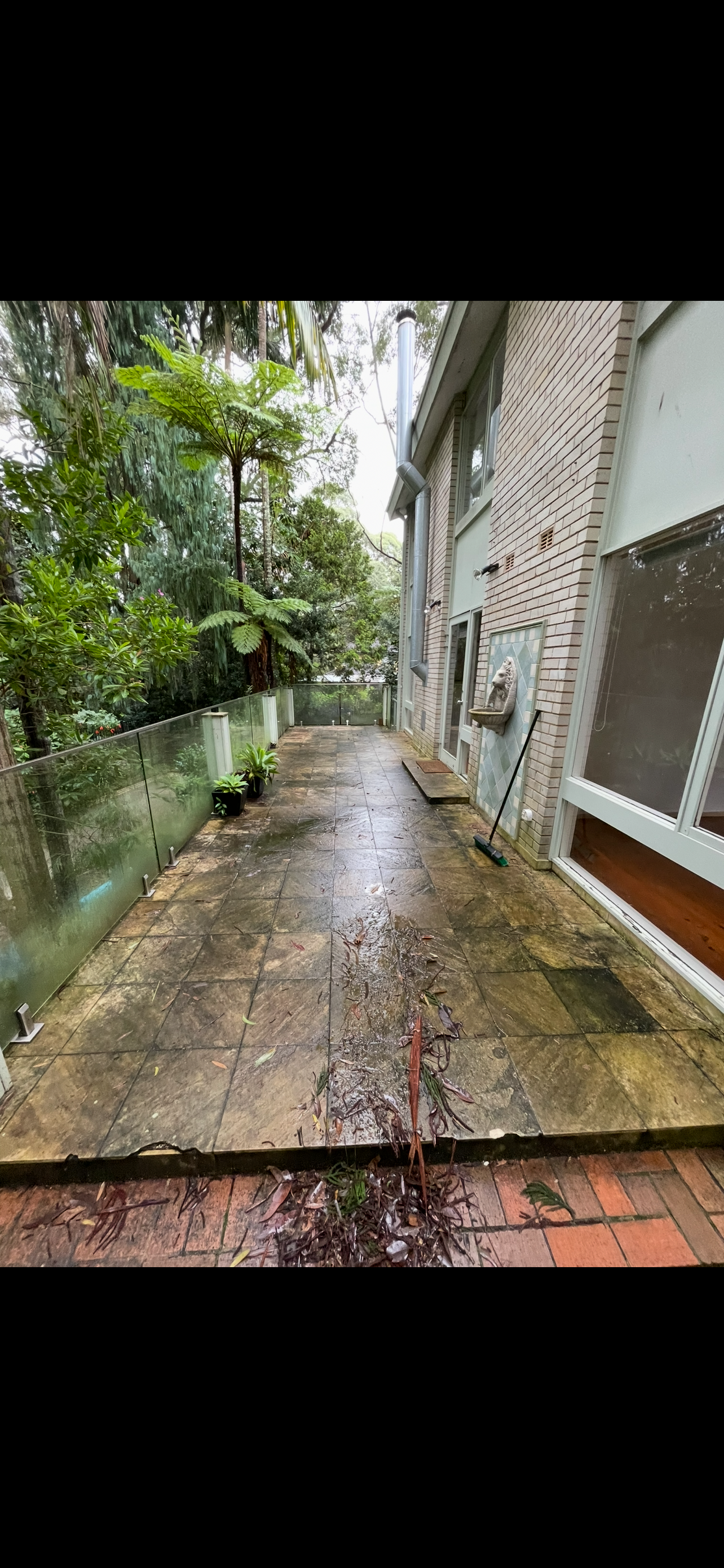 Tiled entrance before pressure washing